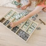 Melissa & Doug Play Money Set - Educational Toy with Paper Bills and Plastic Coins (50 of Each Denomination) and Wooden Cash Drawer for Storage - Image 3